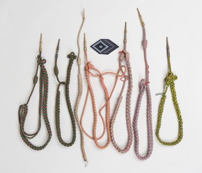 several different types of rope are tied together on a white surface