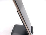 a cell phone that is sitting on top of a stand