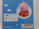 pep the pig in a red car with a blue sky and clouds behind it