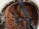 a close up of a helmet with a strap on it