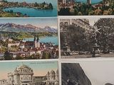 four postcards of a view of a town and a lake