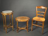two chairs and a table are shown against a gray background