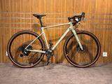 a bike that is parked in front of a wooden wall