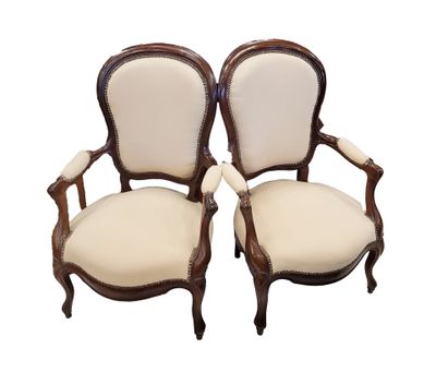 a pair of antique chairs with white upholstered upholstered seats