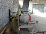 a man that is working on a machine in a building