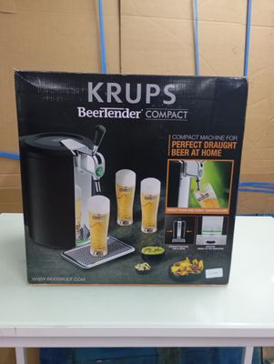 packaging of a beer machine sitting on top of a white table