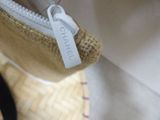 a small bag with a tag on it sitting on a table