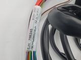 a close up of a cable connected to an electronic device
