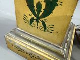 a yellow box with a green design on it