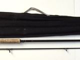 two fishing rods and a fishing rod on a table