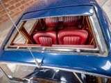 a blue car with red seats in the back of it