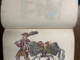 an old book with a picture of a man on a horse