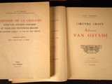 two open books sitting on top of a table next to each other