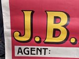a person holding a sign that says j b agent