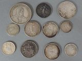 a lot of coins that are sitting on a table