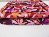 purple, orange, and pink floral print fabric folded on top of each other