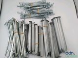 a lot of screws and nails laying on a table
