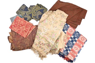 many different types of scarves laid out on a white surface