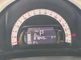 a close up of a car ' s dashboard with a speedometer
