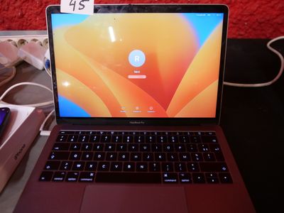 a laptop computer sitting on a table with a price tag on it
