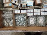 many boxes of screws and nuts on a shelf