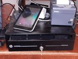 a laptop sitting on top of a desk with a printer on it