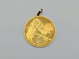 a close up of a gold coin with a bird on it