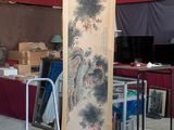 a large oriental painting on display in a room