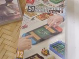 two video games sitting on a table next to each other