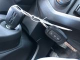 a car key that is connected to a remote control in a car