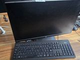a laptop computer sitting on top of a wooden desk
