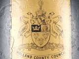 a sign on the side of a building that says holland county council