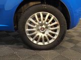a close up of a tire on a blue car