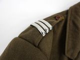 a close up of a jacket with a metal buckle on it