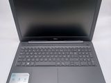 a close up of a laptop computer on a white surface