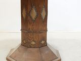 a wooden table with a wooden top and a wooden base