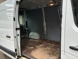 a white van with the door open in a parking lot