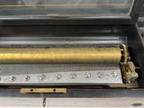 a musical box with a musical instrument inside of it