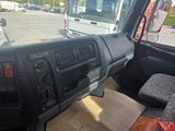 a view of the inside of a truck from the driver ' s seat