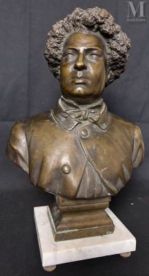 bronze bust of a woman with curly hair on a marble base