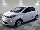 an image of a white electric car on a checkered floor