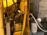 a large yellow machine that is inside of a building