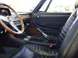a view of the inside of a car from the driver ' s seat