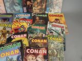 a lot of comic books sitting on a table