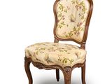 an image of a chair with a floral upholstered seat and back