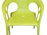 lime green plastic chair with holes on the back
