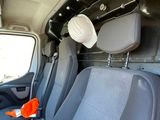 a view of the inside of a van with the front seats down