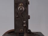 an old sewing machine sitting on top of a piece of luggage