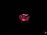 a pink diamond on a black background