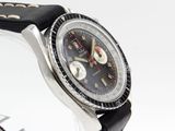 a watch that is sitting on a black leather strap